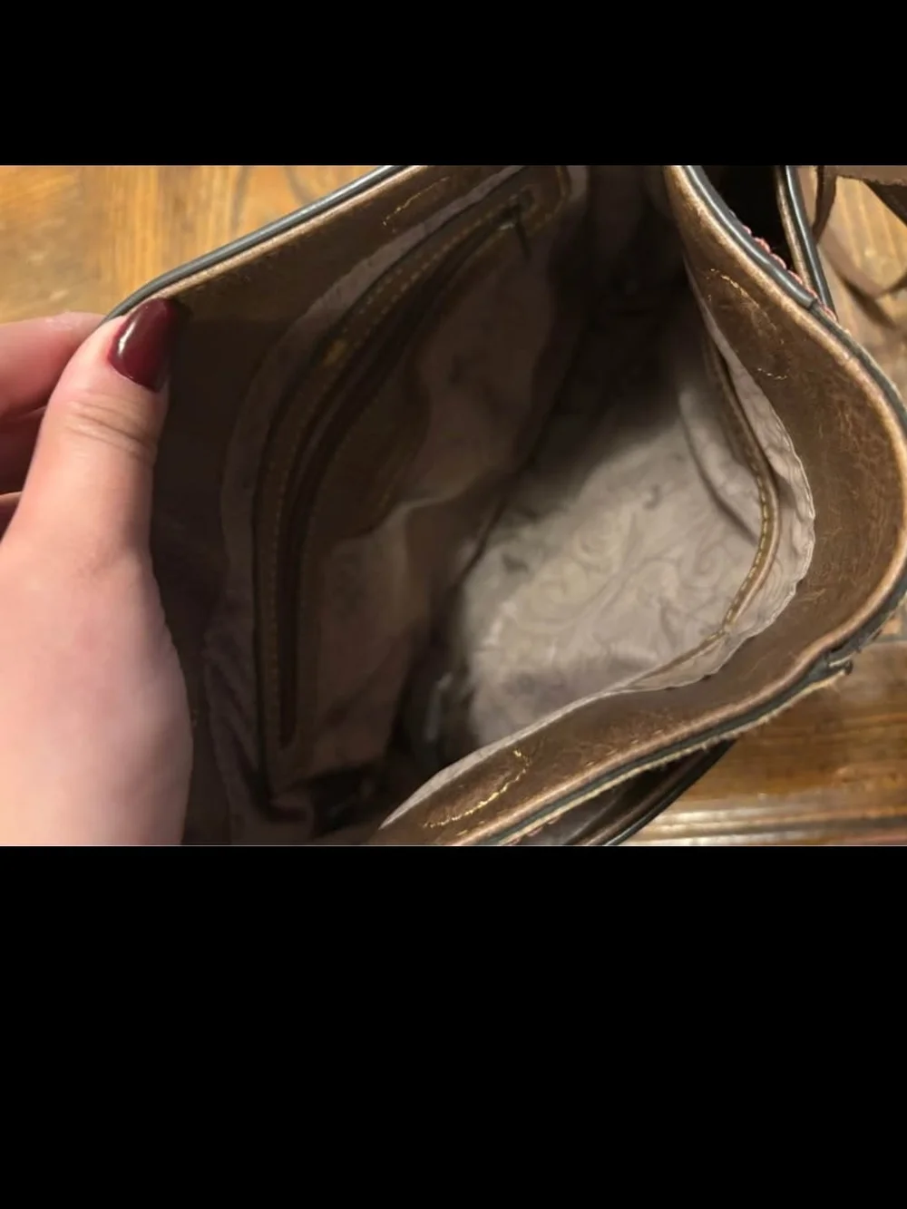 Brown Leather Crossbody Bag with Cowhide Accent and Patterned Strap